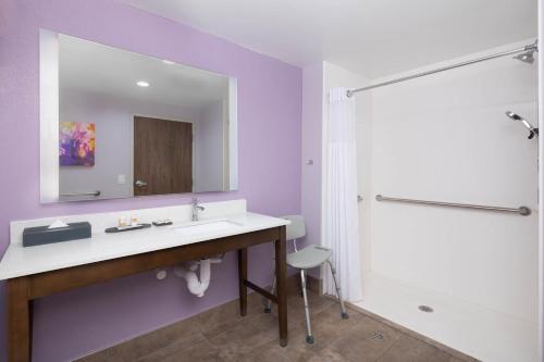 a bathroom with a sink and a shower at La Quinta by Wyndham Perry in Perry