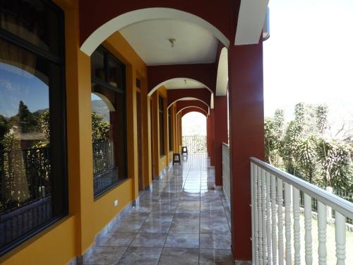 a hallway of a house with orange and yellow walls at Hotel Adulam in San Pedro La Laguna