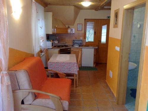 a small kitchen with a table and chairs in a room at Apartment Beli Zajec in Mozirje