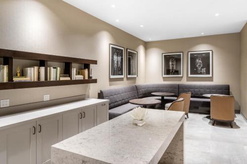a living room with a couch and a table at Omni Houston Hotel in Houston