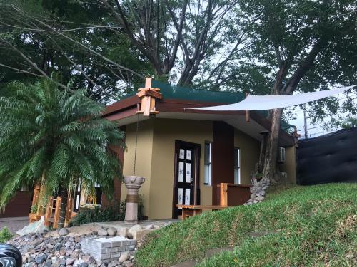 a small house with a hammock on top of it at ARANJUEZ LOFTS Santa Ana in Santa Ana
