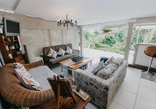a living room with a couch and a table at Sylvern Bed and Breakfast in Durban