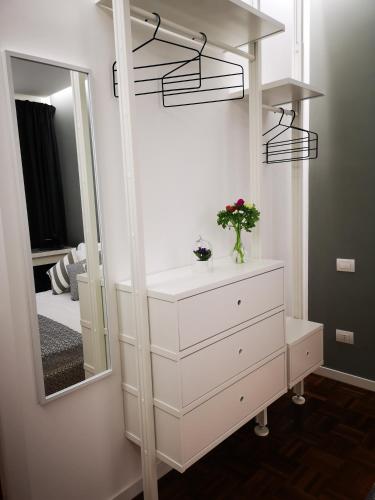 a dressing room with a dresser and a mirror at Moro 34 in Bari