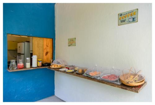 a counter in a room with some food on it at Pousada Mar Azul in Trancoso