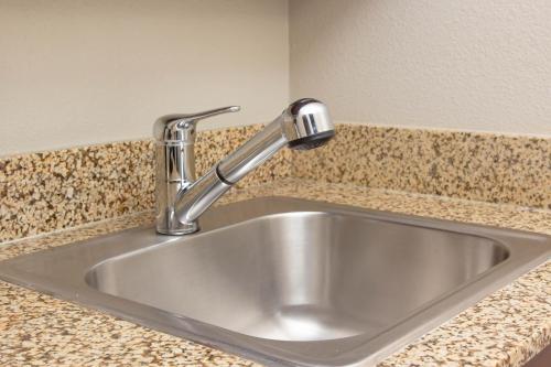 a stainless steel sink in a kitchen counter at Belltown Inn in Seattle