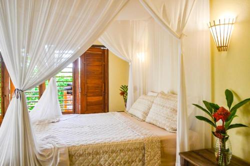 Katil atau katil-katil dalam bilik di Casa Som do Mar - Trancoso