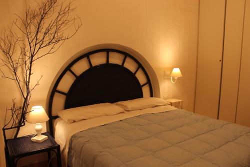 En eller flere senger på et rom på Appartamento a Porto Rotondo - VILLAGGIO PUNTA VOLPE