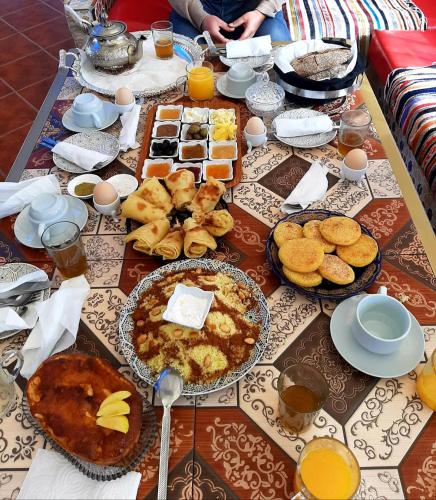 a table full of breakfast foods and drinks at Hotel LAHLOU riad Cafeteria in Oujda