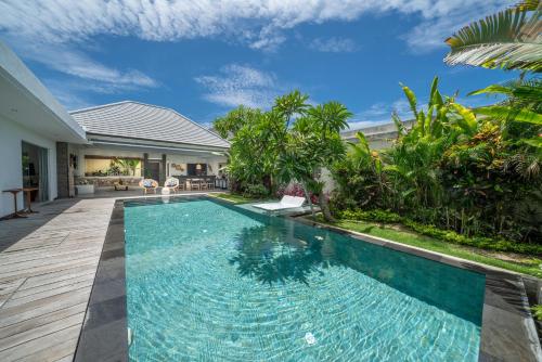 a swimming pool in the backyard of a villa at Villa Bima - 3 Bedroom Villa in Seminyak in Seminyak