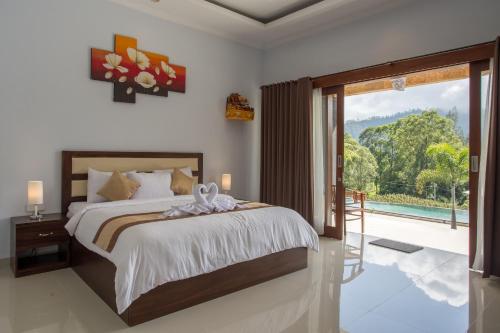Tempat tidur dalam kamar di Mount Batur Villa