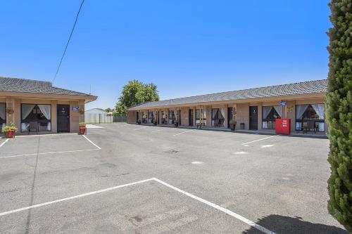 an empty parking lot in front of a building at Comfort Inn May Park in Horsham