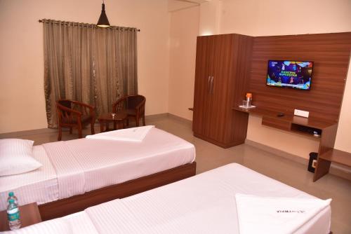 Μια τηλεόραση ή/και κέντρο ψυχαγωγίας στο Hotel Citywalk Residency