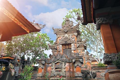 an ornate building with trees in the background at Kandjeng Puri Kailas Canggu in Sempidi