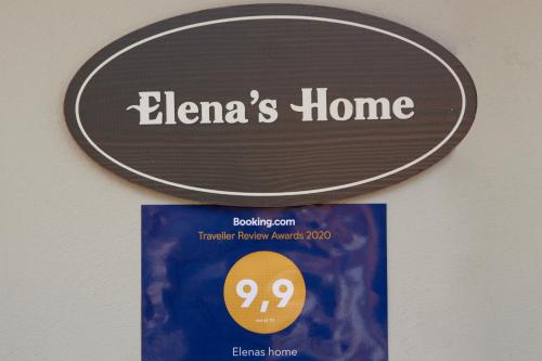 a sign on a wall that reads elenas home at Elenas home in Vasiliki