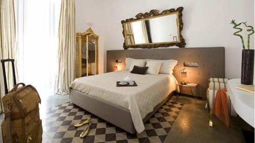 Un ou plusieurs lits dans un hébergement de l'établissement Gem De Luxe Suite Catania