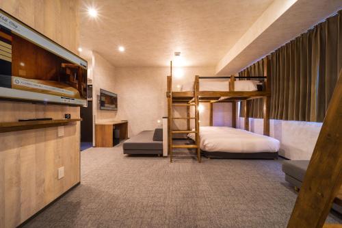 Ένα ή περισσότερα κρεβάτια σε δωμάτιο στο WELLSTAY Namba