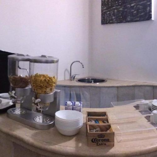 a kitchen counter with a food processor on a counter at Ace Rooms VSG in Villa San Giovanni
