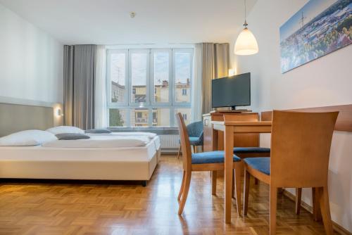 Postel nebo postele na pokoji v ubytování Hapimag Ferienwohnungen München