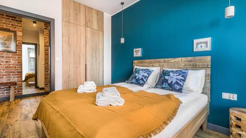 En eller flere senge i et værelse på 4 Elements - BillBerry Apartments