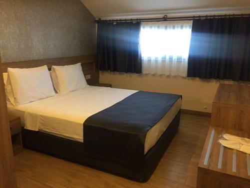 Katil atau katil-katil dalam bilik di Golden World Suite Hotel