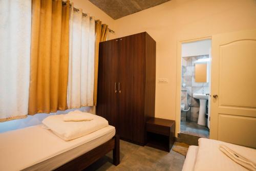 Postel nebo postele na pokoji v ubytování Draper Startup House ,Koramangala