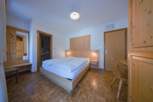 Ένα ή περισσότερα κρεβάτια σε δωμάτιο στο Locanda Pensione Maria