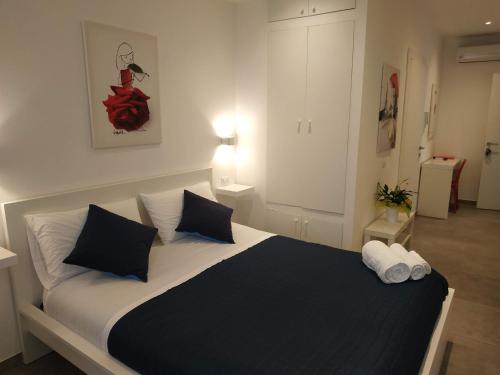 Ένα ή περισσότερα κρεβάτια σε δωμάτιο στο Palazzo Verdi Holiday Viterbo