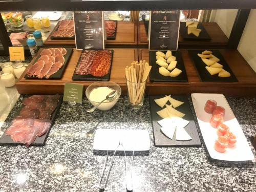 a display of different types of food in a bakery at Parador de Ribadeo in Ribadeo