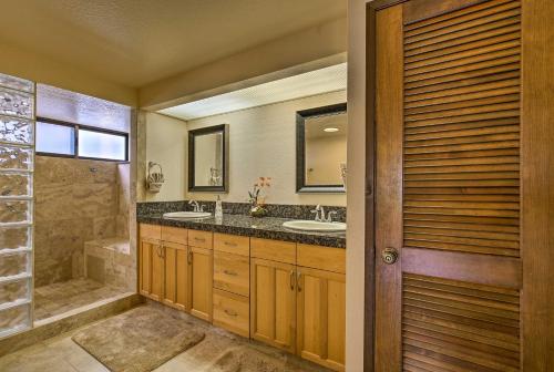 a bathroom with two sinks and a shower at Kailua-Kona Condo with Resort Access and Ocean View! in Kailua-Kona