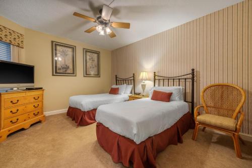 Ένα ή περισσότερα κρεβάτια σε δωμάτιο στο Villas Of Amelia Island