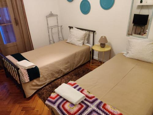 Postel nebo postele na pokoji v ubytování Vasco Santana Guesthouse