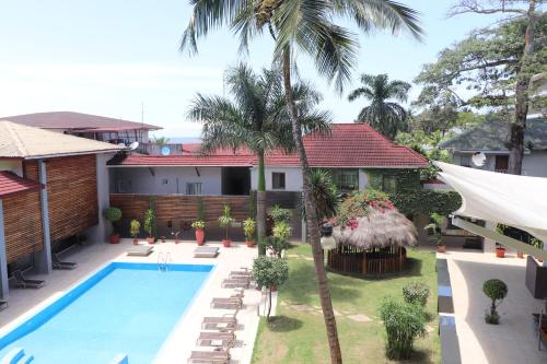 an aerial view of a house with a swimming pool at Mamba Point Hotel in Monrovia