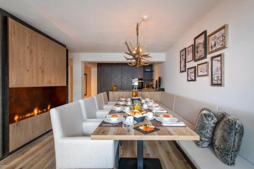 a dining room with a table and chairs at Brunnenhof Luxury Apartments in Lech am Arlberg