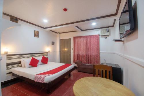 Tempat tidur dalam kamar di OYO 774 Havprins Building