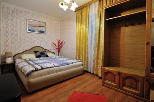 a bedroom with a bed and a dresser in it at Motel Edem in Mostar