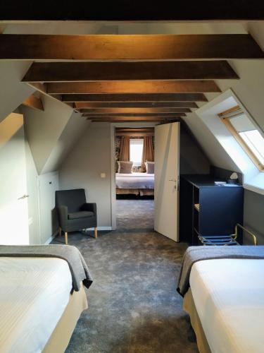 a attic room with two beds and a bedroom at Hotel Lepelbed in Ghent