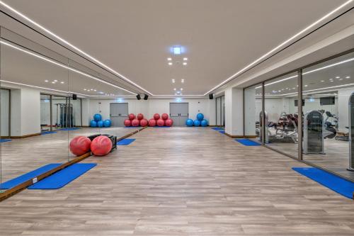 a gym with paddles and balls on the floor at Amada Colossos Resort in Faliraki