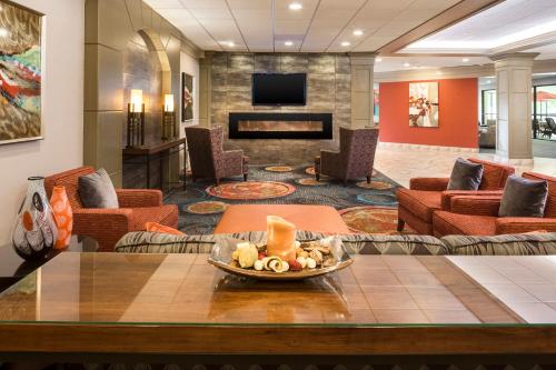a lobby of a hotel with a waiting room at Holiday Inn Wichita East I-35 by IHG in Wichita