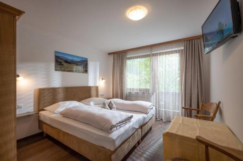 Postel nebo postele na pokoji v ubytování Pension Kumbichlhof