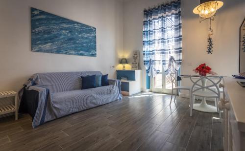 a living room with a couch and a table at Scricciolo in Viareggio