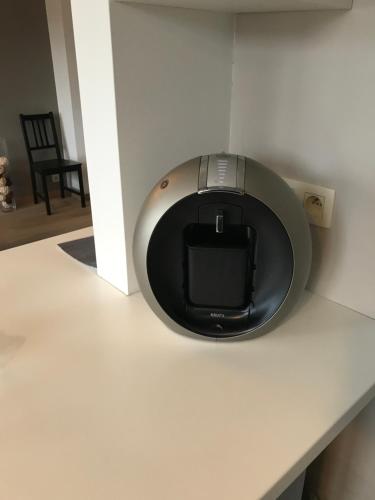 a tv sitting on a counter in a room at La Petite Villa in Spa