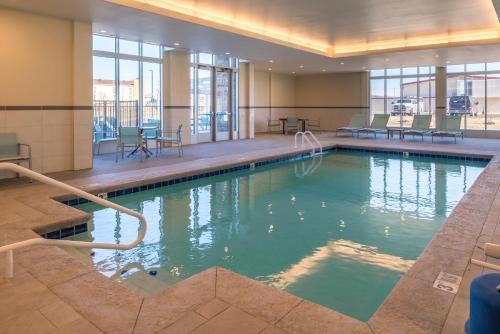 a large swimming pool in a hotel room at Holiday Inn Joplin, an IHG Hotel in Joplin