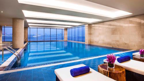 a swimming pool in a hotel with a view at Holiday Inn Nanchang Riverside by IHG in Nanchang