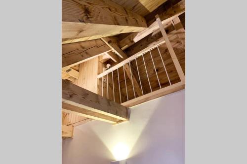 an empty room with wooden ceilings and wooden beams at NEW Acogedor adosado en Salardu. in Salardú