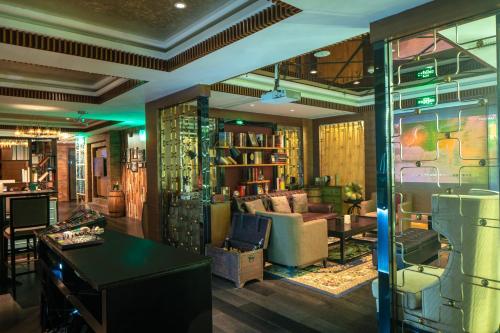 a living room with a couch and a table at Holiday Inn Nanchang Riverside by IHG in Nanchang