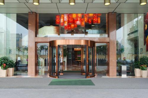 an entrance to a building with a revolving door at Holiday Inn Xiaoshan by IHG in Hangzhou