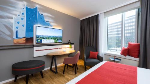 Кровать или кровати в номере Holiday Inn Hamburg - City Nord by IHG