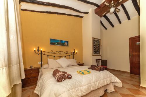 Tempat tidur dalam kamar di Terra Blanca del Benicadell