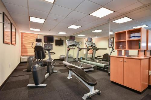 a gym with treadmills and ellipticals in a room at Holiday Inn Lumberton by IHG in Lumberton