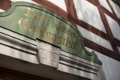 a sign on a building that says san antonias civic institution at Gutshof Andres in Kirchlauter